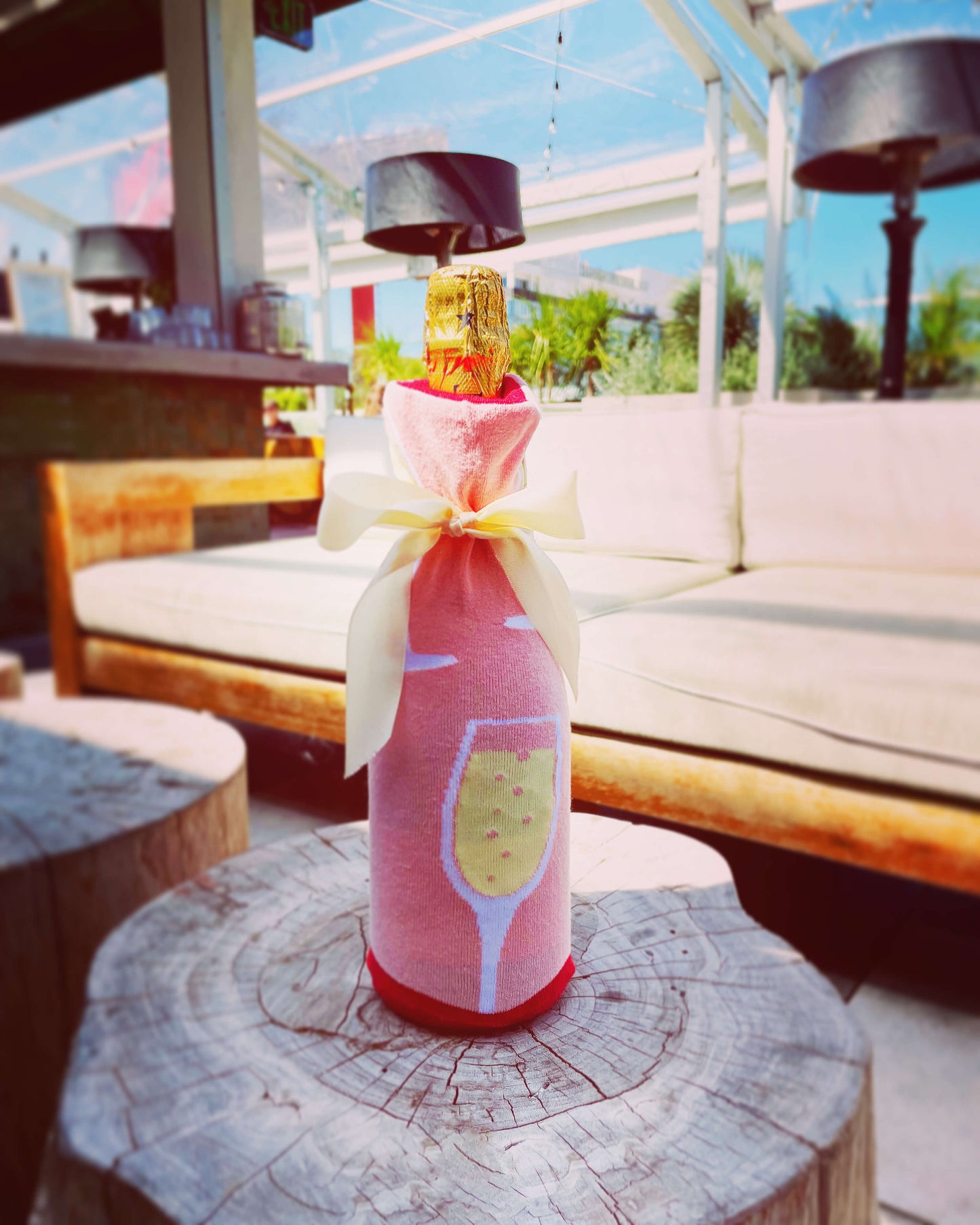 illustrating a step-by-step guide for DIY wine bottle wrapping, a creative and personalized way to present gifts.