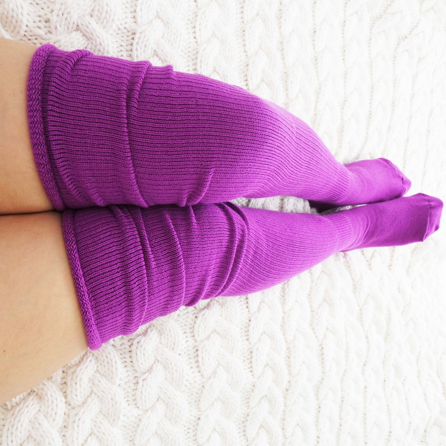 thigh high socks in a beautiful purple color, designed to fit and flatter plus size individuals with comfort and style