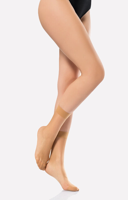 mid-calf sheer socks in a dark nude color, offering a sleek and elegant accessory for various fashion styles.