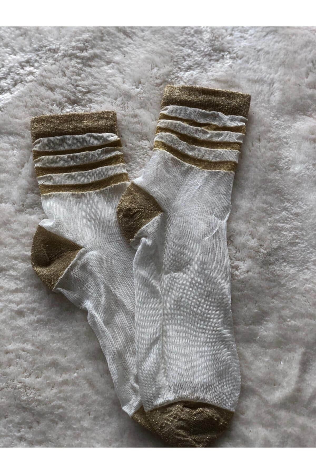 Women's lace socks with a striped design, showcasing a blend of elegance and playful charm in their unique pattern
