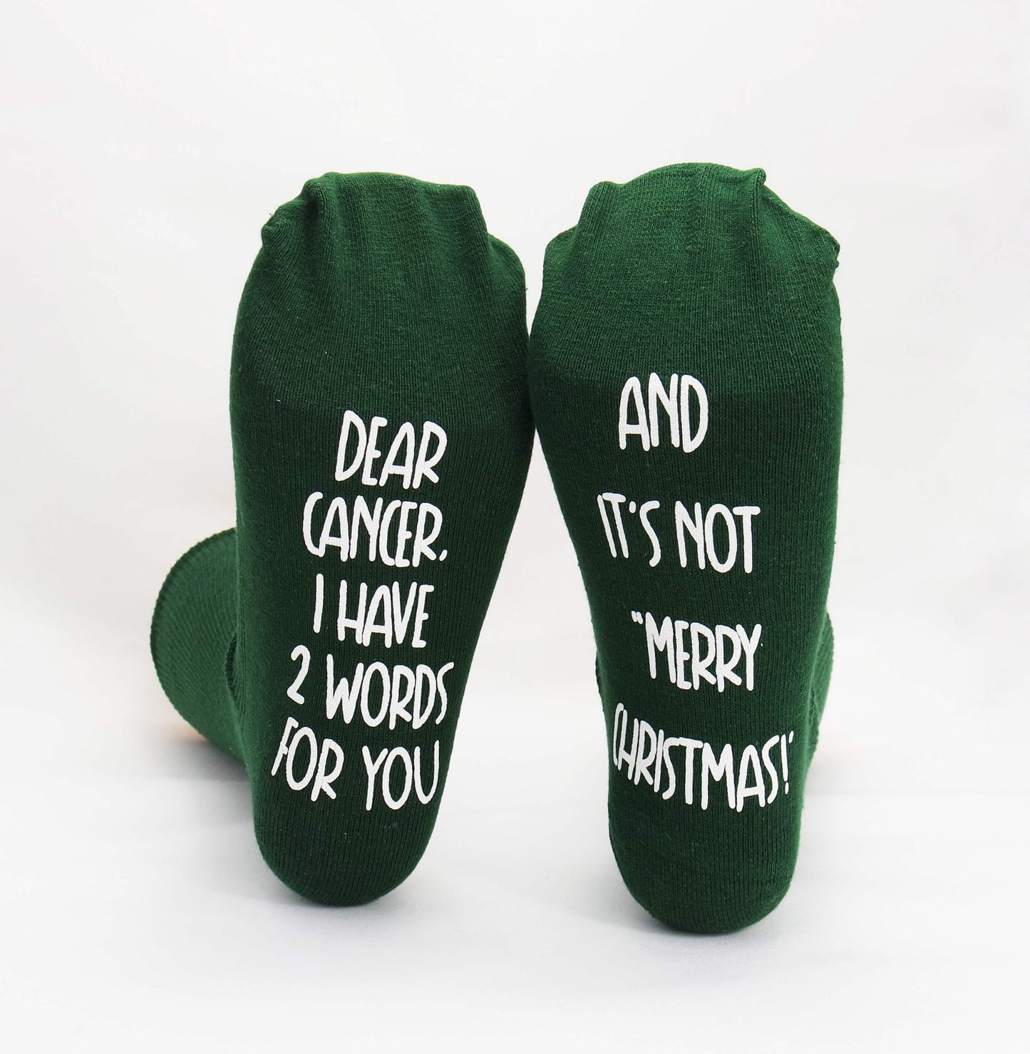 Women green socks with a powerful message for cancer, embodying determination and courage.