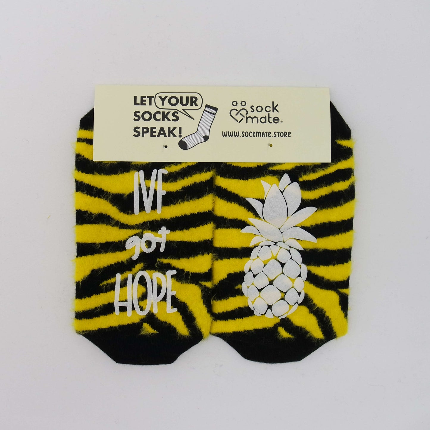 IVF socks with the motivating phrase 'Stick baby stick,' symbolizing hope and encouragement during the in vitro fertilization (IVF) journey.