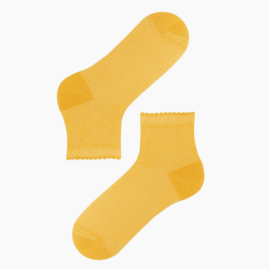 yellow glitter socks, adding a sparkling and vibrant touch to any outfit.