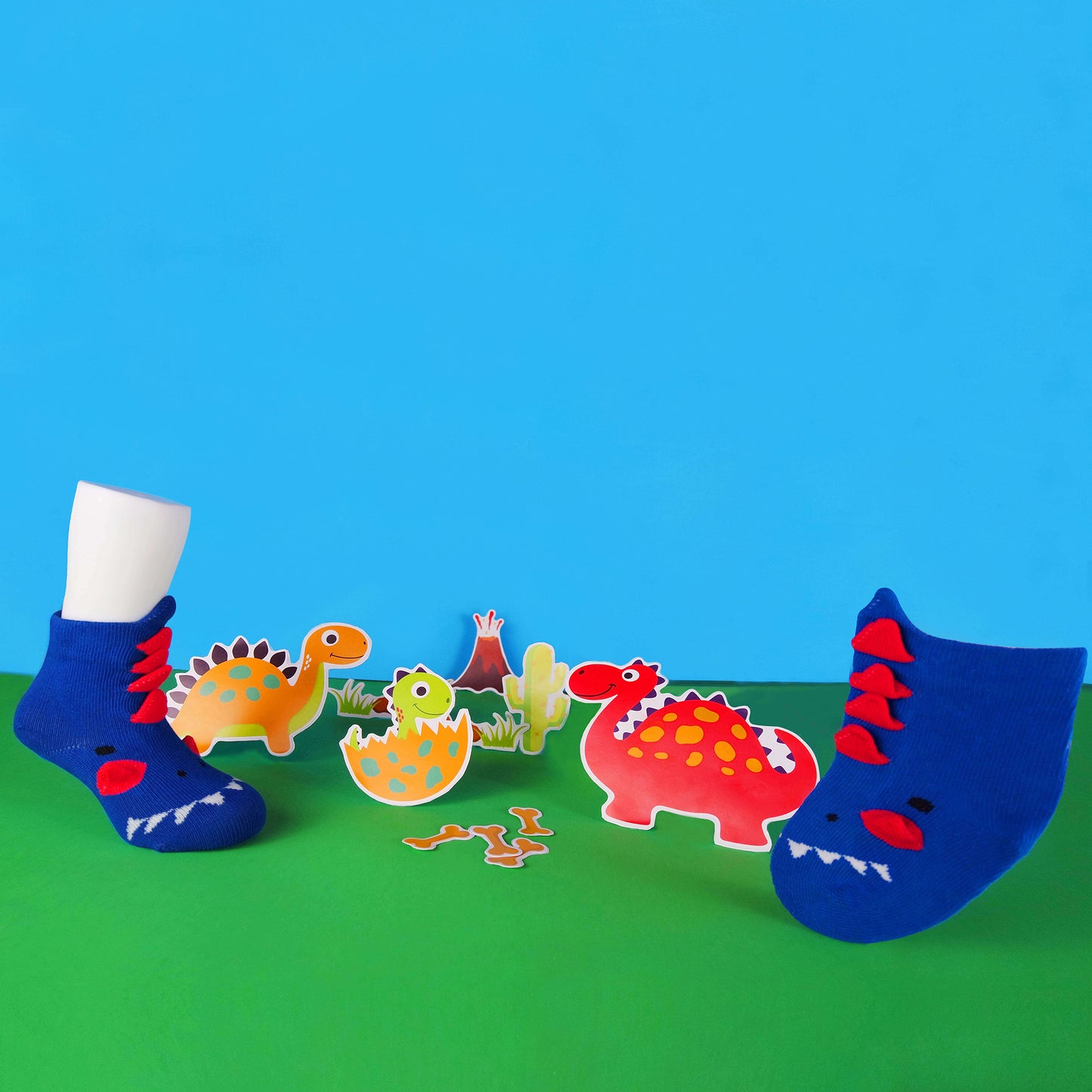 Image of navy blue dinosaur-themed 3D baby socks, showcasing a charming dinosaur motif."