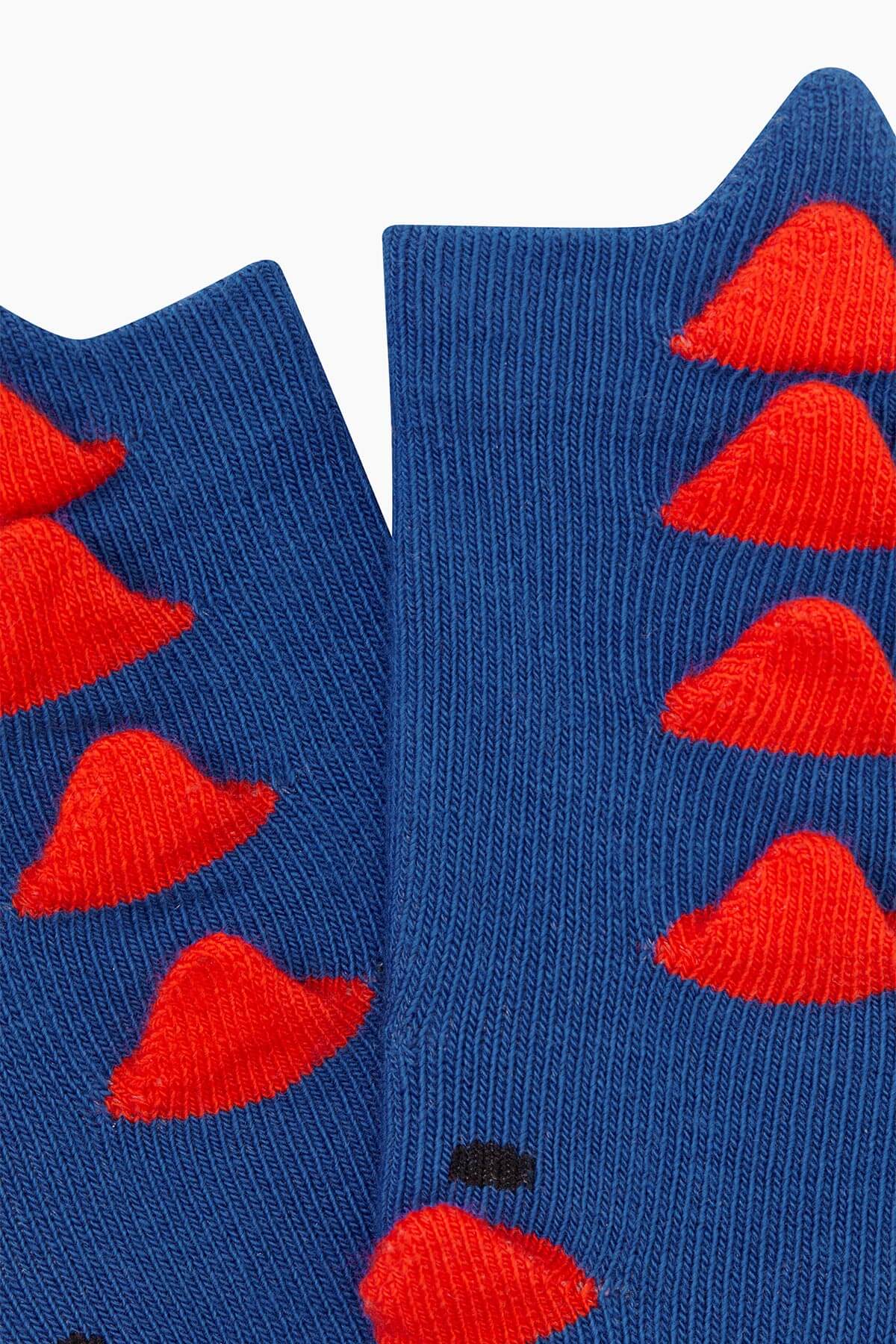 Vibrant 3D navy blue dinosaur baby socks with lively dinosaur illustrations.