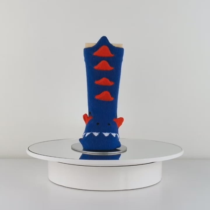 Colorful 3D navy blue dinosaur baby socks designed with a whimsical dinosaur pattern.