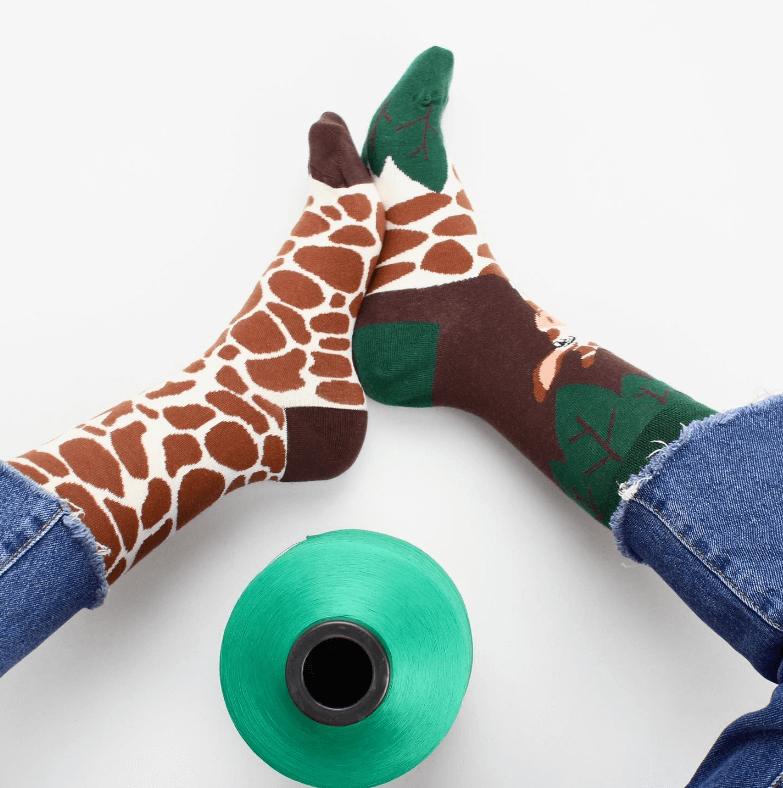 Safari themed socks for any occasion. Giraffe pattern mismatched sock design by Sockmate. Jungle hosiery