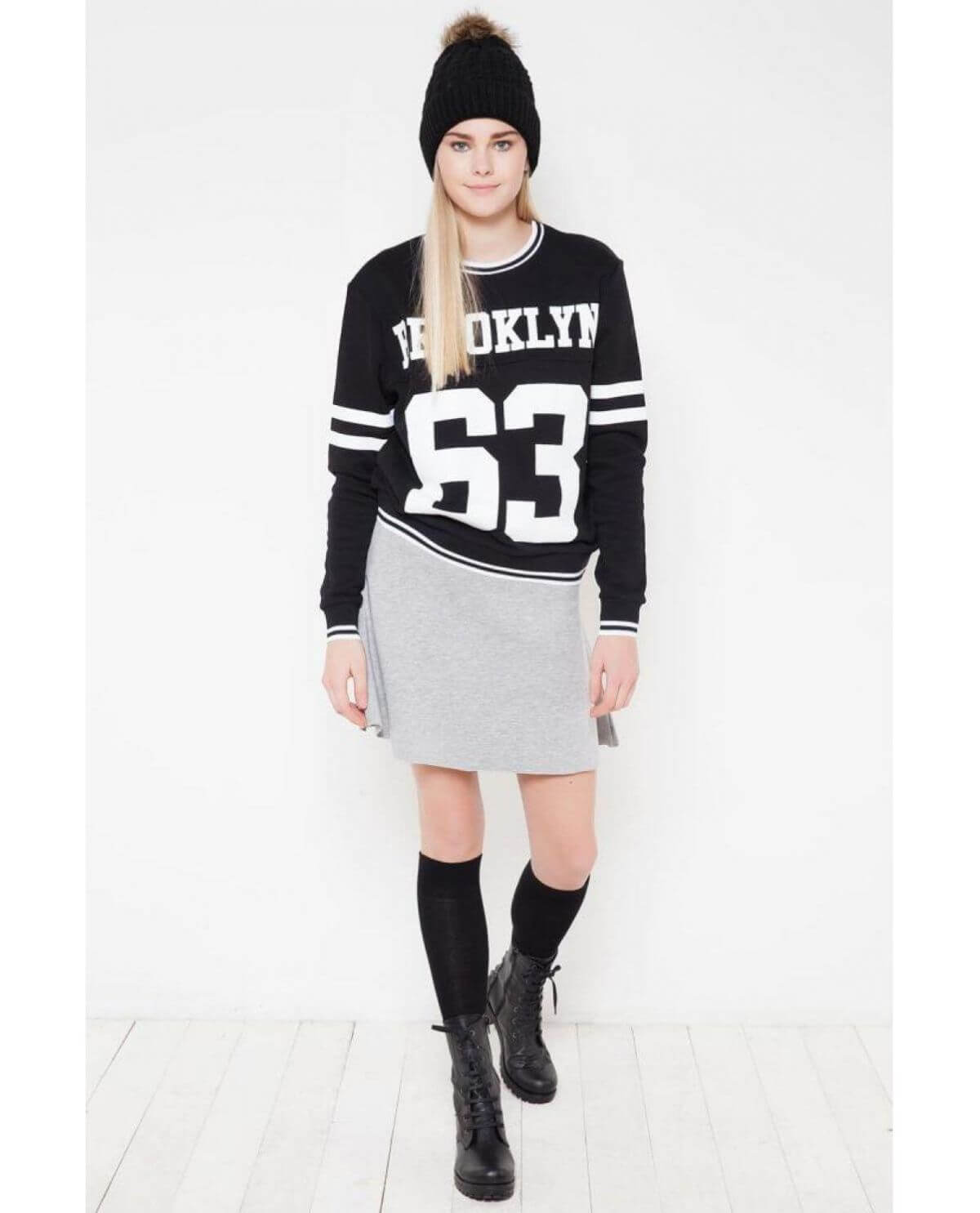 knee-high black solid socks, offering a classic and versatile accessory for various outfits and occasions.