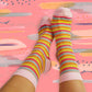 Women's sheer socks with elegant pink-toned stripes, perfect for adding a pop of color and charm to any ensemble.
