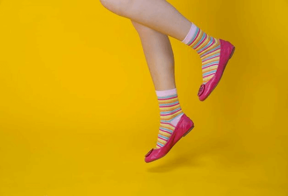 women's sheer socks featuring fashionable pink-toned stripes, elevating the overall style with a touch of sophistication