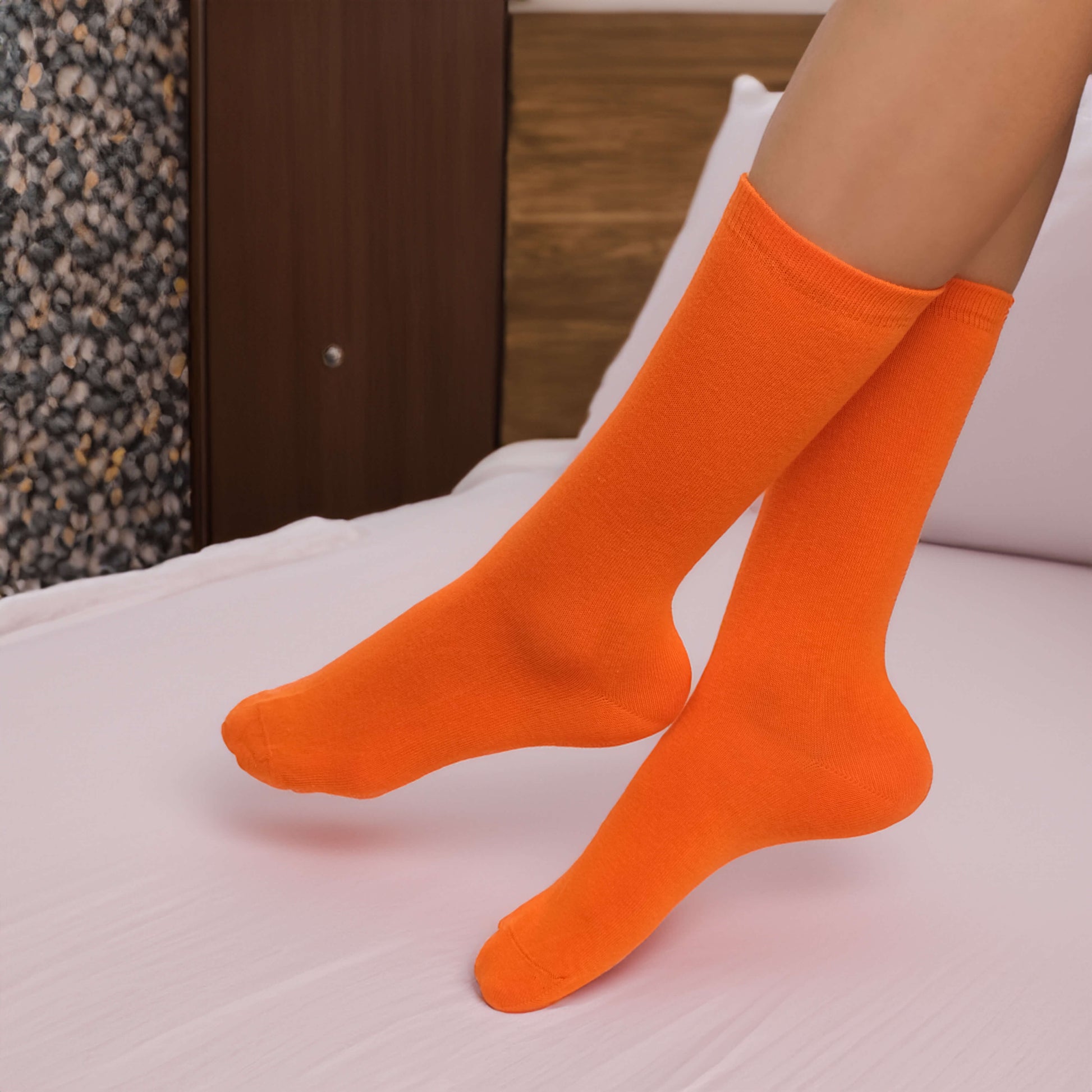 Pack of six comfortable cotton socks with solid patterns in vibrant colors such as navy blue, red, green, yellow, purple, and pink. Elevate your sock game with this colorful set.