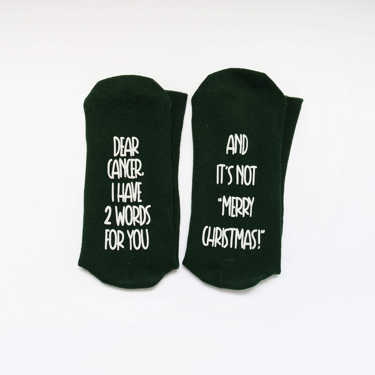 socks with a defiant message for cancer, expressing strength and resilience in the face of adversity.