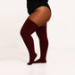 Plus size thigh high socks in a captivating maroon color, providing a fashionable and inclusive choice for all body types.