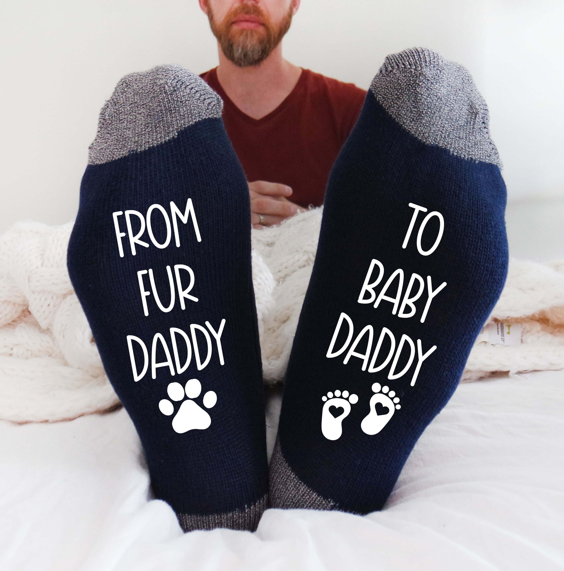 socks with the heartwarming phrase 'From fur daddy to baby daddy,' celebrating the transition from pet parenting to becoming a father of a human baby.