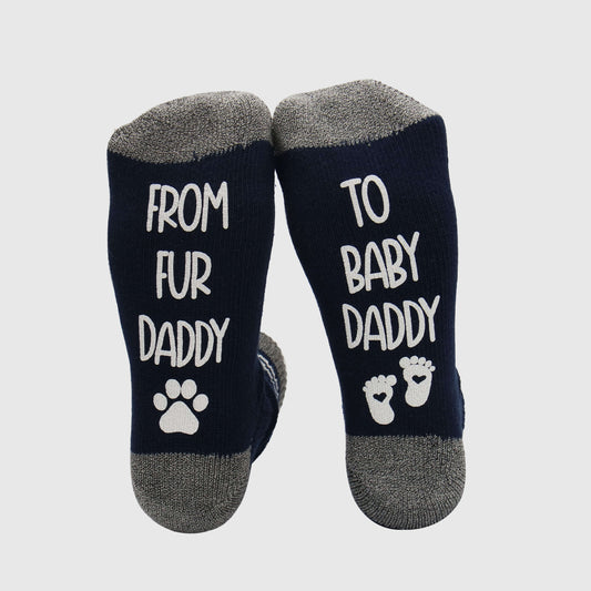 socks with the heartwarming phrase 'From fur daddy to baby daddy,' celebrating the transition from pet parenting to becoming a father of a human baby