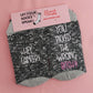 socks with the defiant phrase 'Hey cancer, you picked the wrong bitch,' displaying courage and strength in the face of cancer.