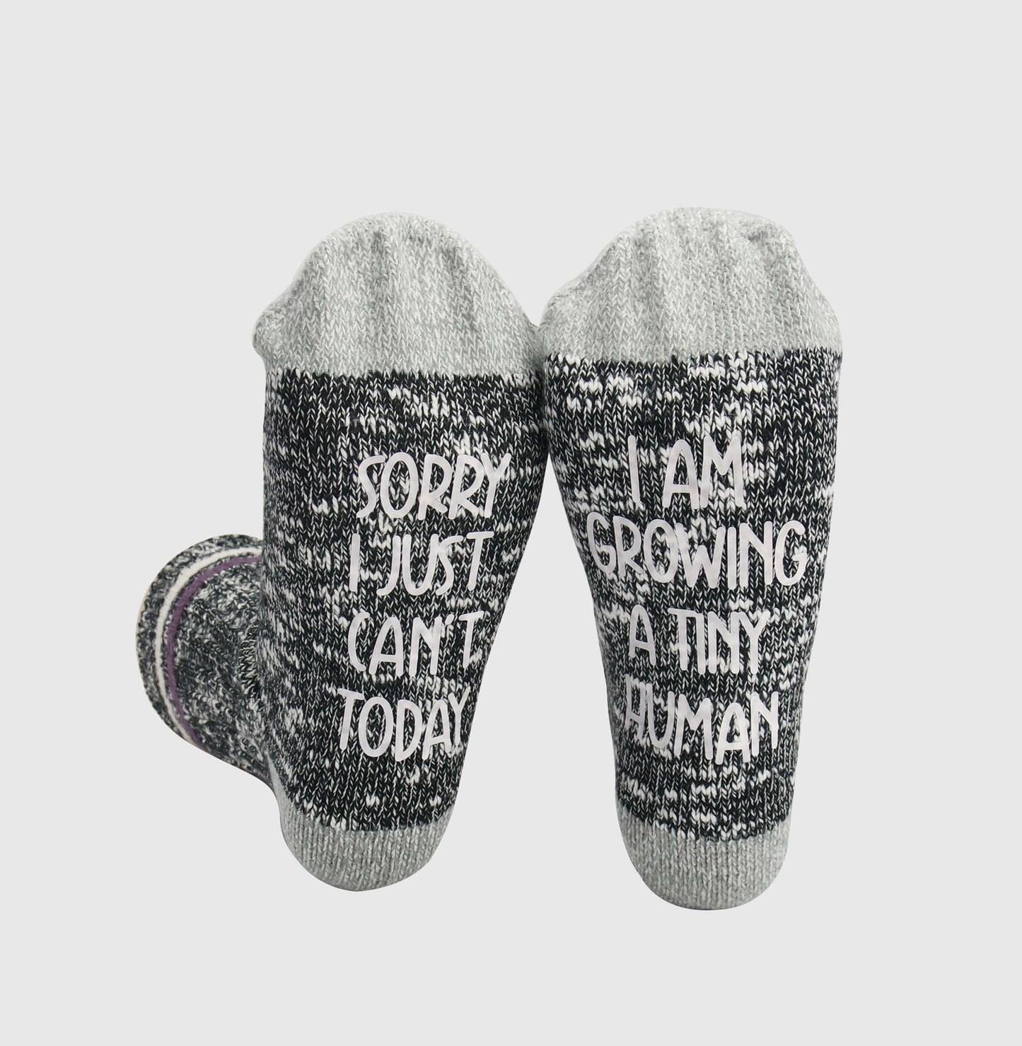 Comfortable socks featuring a witty phrase about pregnancy, capturing the transformative experience of growing a tiny human.
