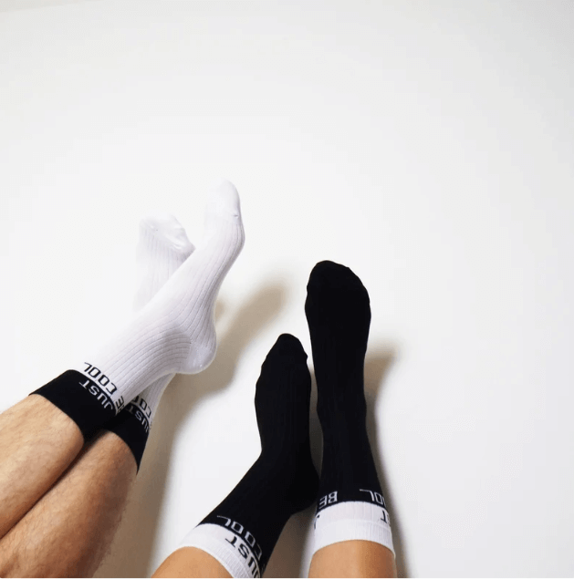 Socks for couples with a fun message, encouraging them to embrace a cool and relaxed attitude with the phrase 'Just Be Cool.