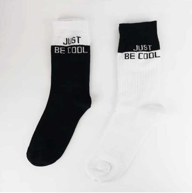 couple's socks featuring the playful message 'Just Be Cool,' adding a touch of humor to their matching sock style.