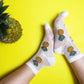 women's white sheer socks with delightful pineapple embroidery, adding a fun and playful element to the design.