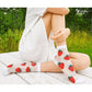 women's white sheer socks with charming strawberry embroidery, offering a delightful and whimsical touch to the design