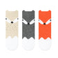 knee-high socks with a charming fox pattern design, adding a touch of whimsy and cuteness to the outfit."