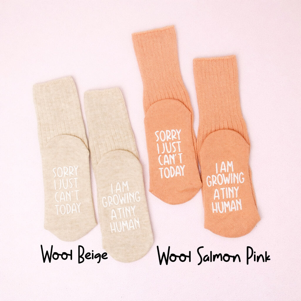 Two pairs of pregnancy socks in wool beige and wool salmon pink with text on a white background.