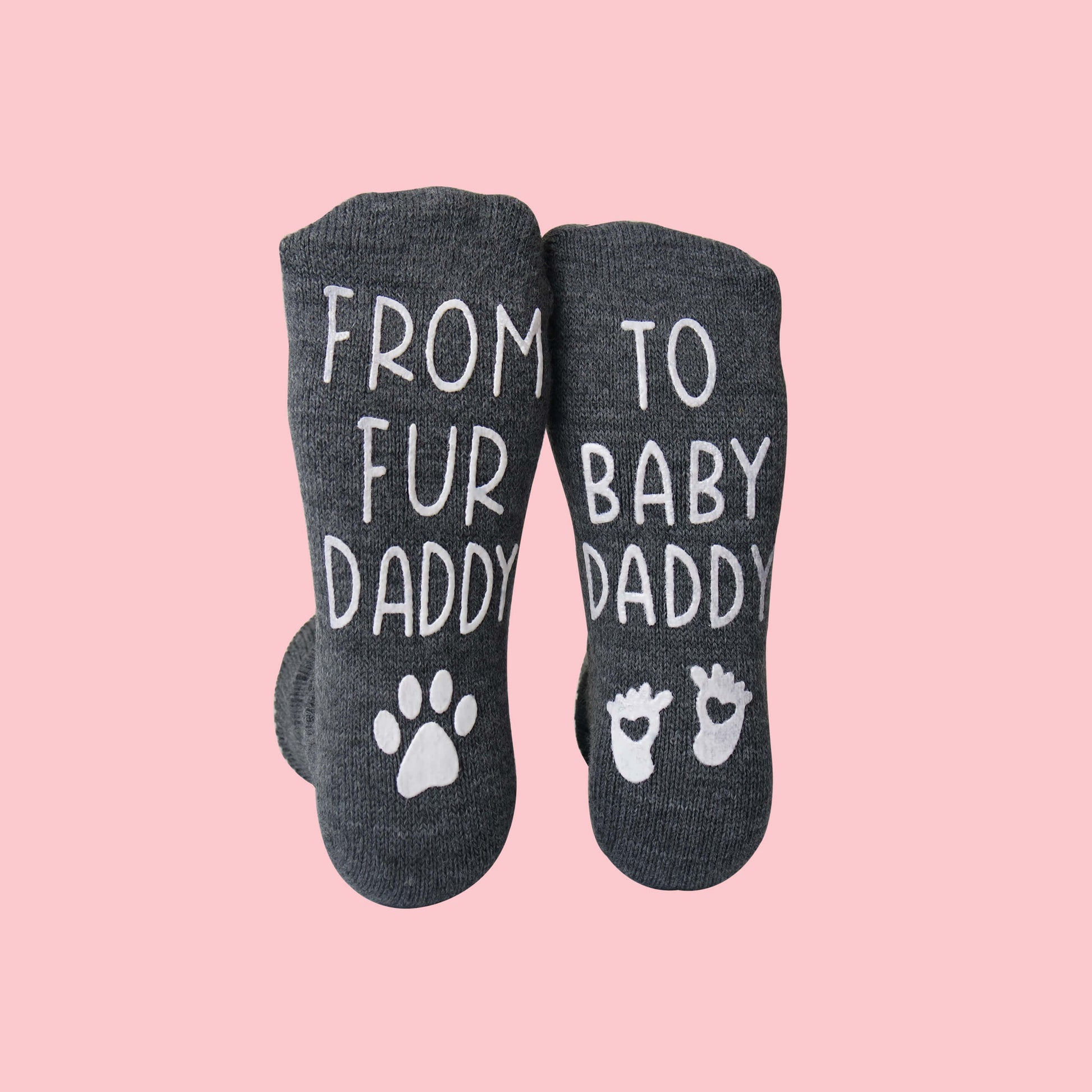 Gray socks with text and paw prints on a pink background