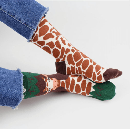 Safari themed socks for any occasion. Giraffe pattern mismatched sock design by Sockmate. Jungle hosiery
