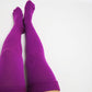  plus size thigh high socks in a lovely purple color, providing a fashionable and comfortable option for individuals with larger legs.