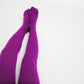  plus size thigh high socks in a rich purple color, offering a comfortable and flattering fit for curvier legs.