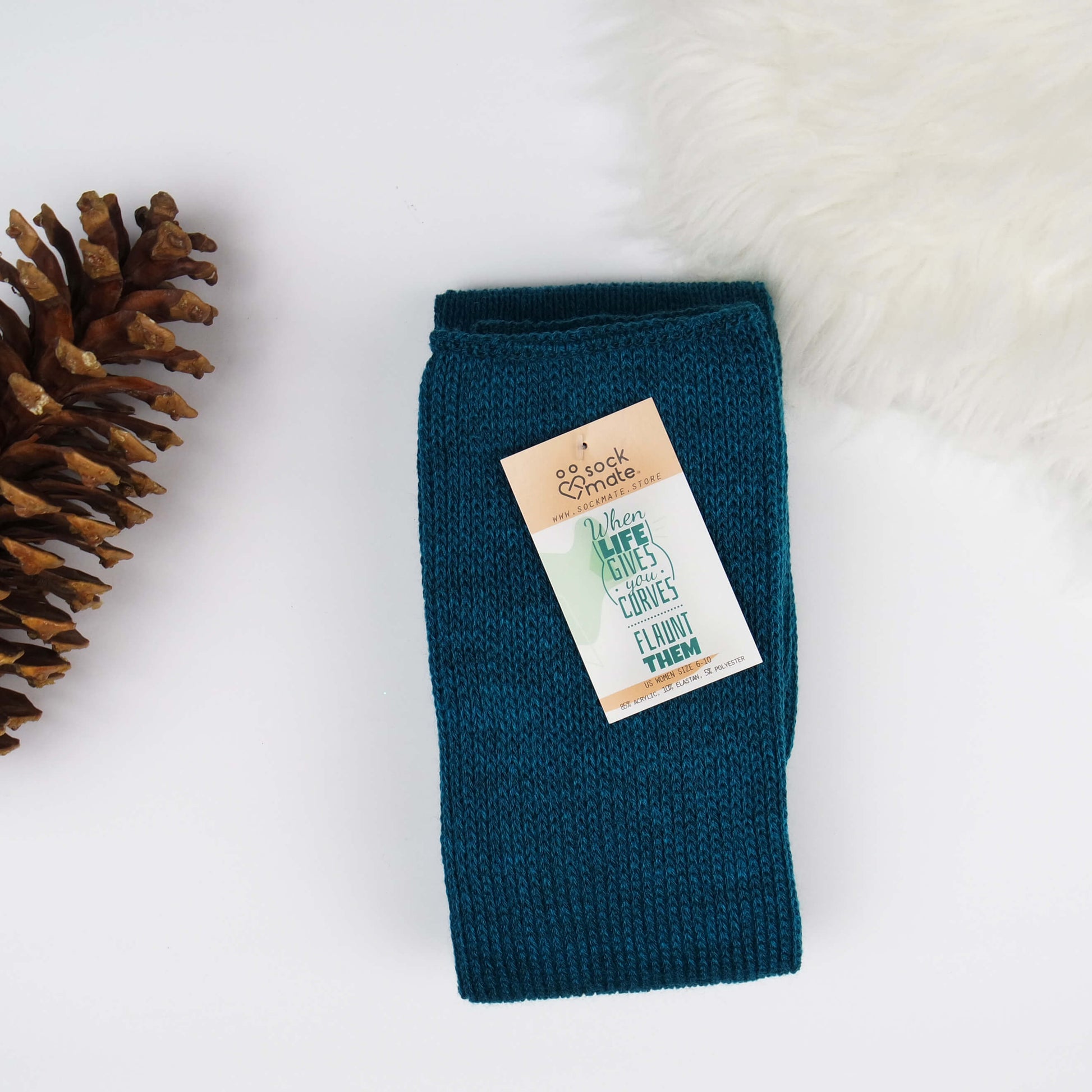 Plus size thigh high socks in a delightful shade of teal, providing a fashionable and inclusive choice for all body types.